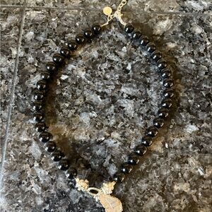 Sophisticated Black Beaded Necklace with Silver Charm